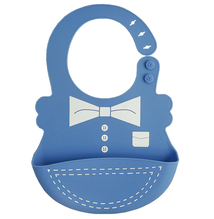 Blue silicone baby bib with a tuxedo design, featuring a bow tie and buttons. It has adjustable fastening with star buttons and a pocket for catching food.