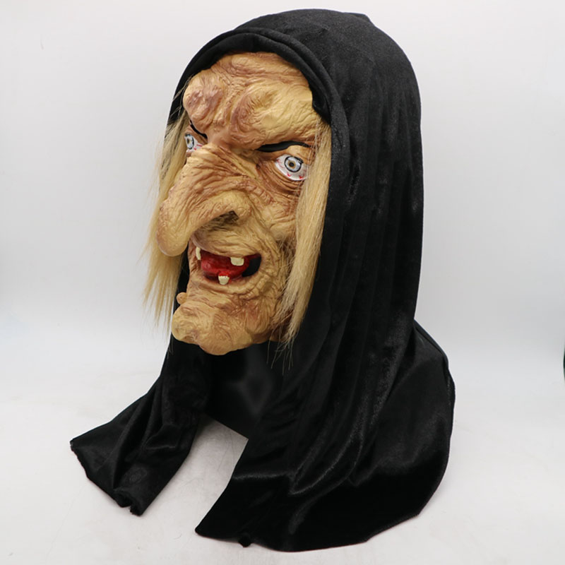 A witch mask with exaggerated features, long nose, and crooked teeth, wearing a black hood. Pale, wrinkled skin and wild eyes add to the eerie appearance, set against a plain background.
