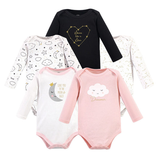Five baby onesies with celestial designs: black with "shine like a star," two white with clouds and stars, white with a moon graphic, and pink with a sleeping cloud marked "Dreamer."