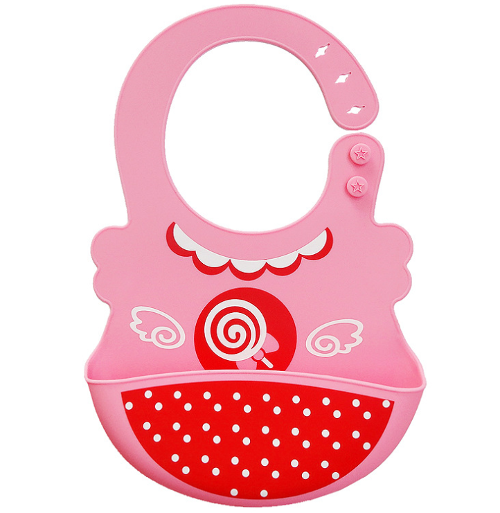 Pink silicone baby bib with a lollipop design and red polka-dot pocket. Features adjustable strap with two star buttons and decorative white wings on the front.