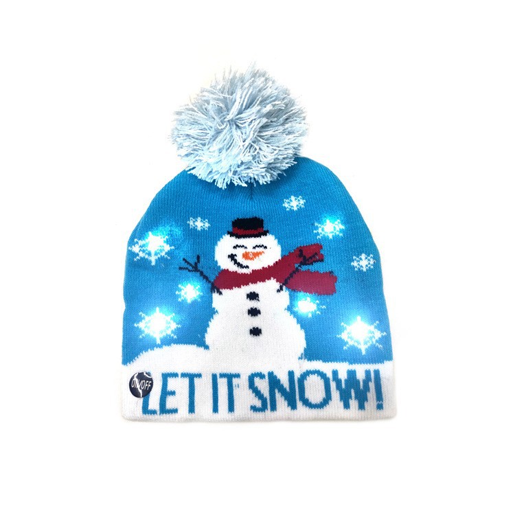 Blue winter hat with a fluffy pom-pom, featuring a snowman with a red scarf and hat. White snowflakes surround it with text "Let it snow!" at the bottom.