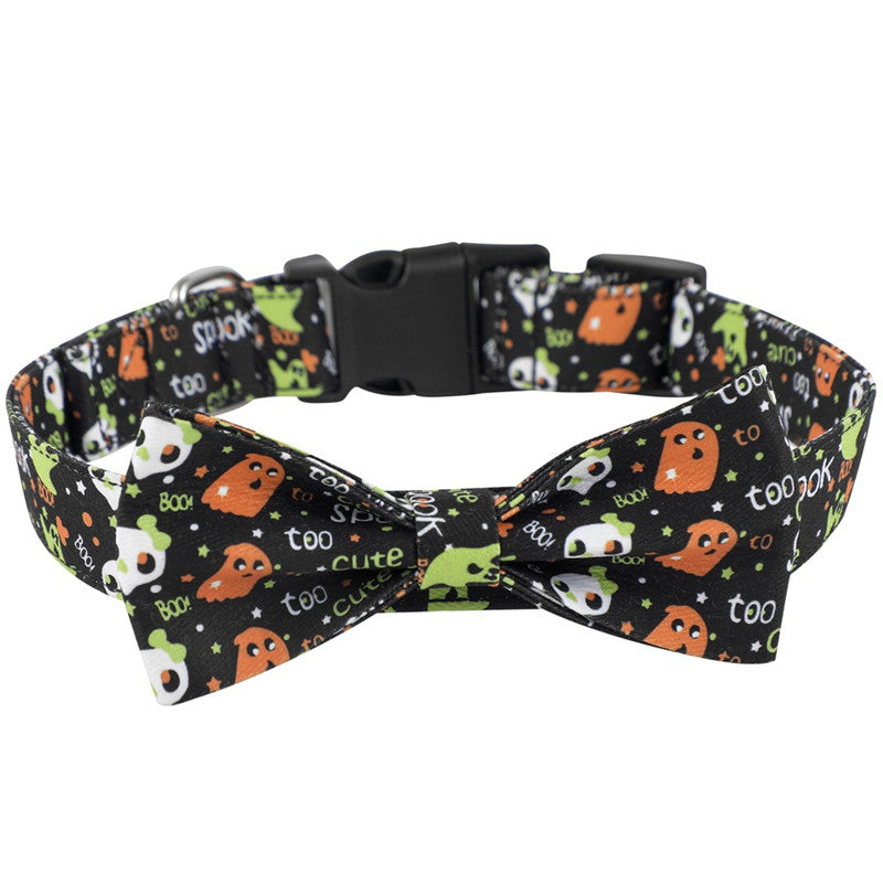 Black pet collar with a Halloween theme, featuring orange ghosts, green aliens, white skulls, and text like "too cute" and "boo" on a bow tie design.