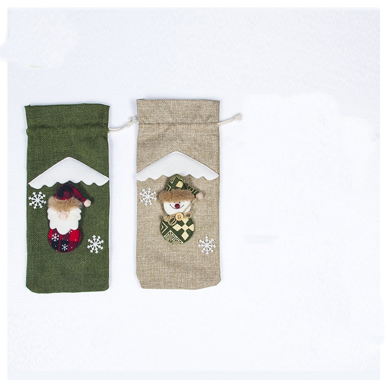 Two festive gift bags featuring a Santa on a green bag and a snowman on a beige bag, with white snowflake decorations on a light background.