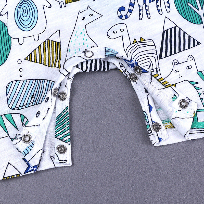 Close-up of a baby romper with colorful animal and geometric prints, featuring metal snap buttons on the crotch for easy fastening. The fabric is soft and patterned.
