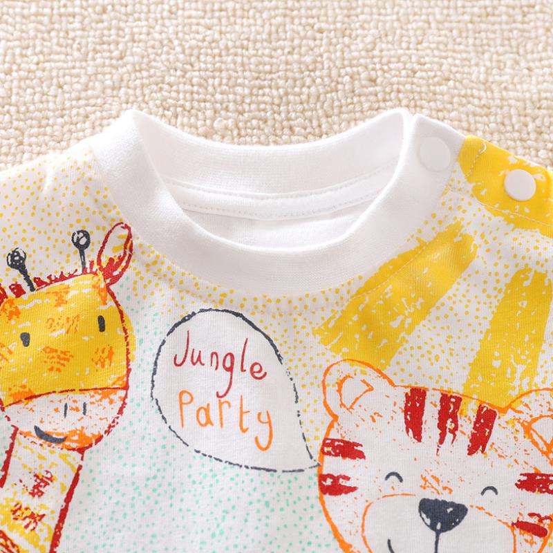 Close-up of a colorful children's T-shirt with cartoon giraffe and tiger, featuring the text "Jungle Party." The shirt has a white collar and yellow accents on a textured background.