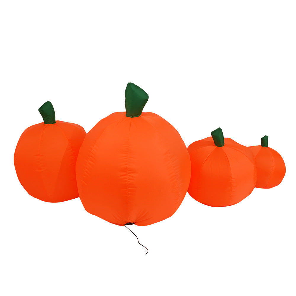 Inflatable pumpkins in various sizes with bright orange bodies and green stems are arranged together on a plain white background.
