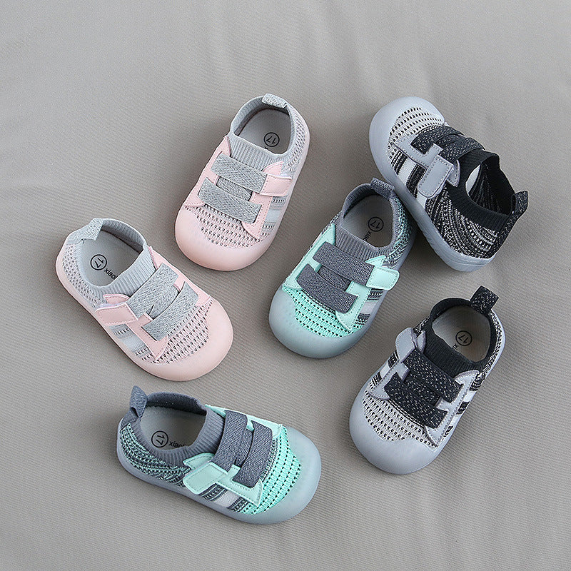 Six pairs of toddler shoes displayed on a gray background, featuring various colors like pink, mint green, and black, with breathable mesh material and Velcro straps.