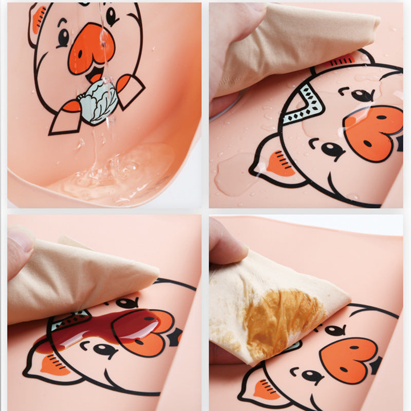 Collage of four images showing a pink bib with a pig design being cleaned. Water is poured, and a cloth wipes away liquid and food residue, demonstrating easy cleaning.