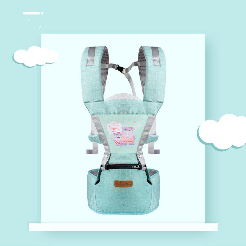 Mint green baby carrier with hip seat, featuring a cartoon hippo design on the front. The carrier is displayed on a pastel blue background with white cloud graphics.