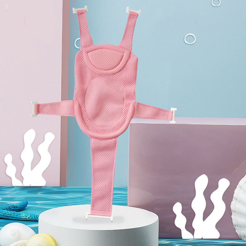 Pink mesh baby carrier on a pedestal with an aquatic-themed background, featuring sea shells and white coral shapes.