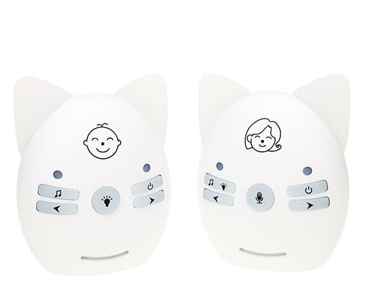Two white baby monitors resembling cat faces, with ears on top. The left has a baby icon, the right has a parent icon. Each features buttons for music, power, and other functions.