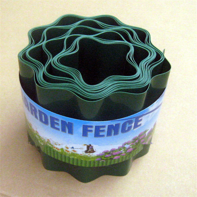 Rolled green plastic garden border with a decorative label featuring flowers and the text "Garden Fence" in bold letters.