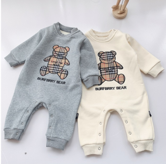 Two baby onesies with "BURFBRRY BEAR" and checkered teddy bear designs. One is gray, and the other is cream, both with button closures and cuffed sleeves.