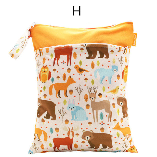 Colorful pouch with a bright orange top and a whimsical pattern of woodland animals like bears, foxes, and owls. The fabric features trees and acorns, enhancing the playful design.