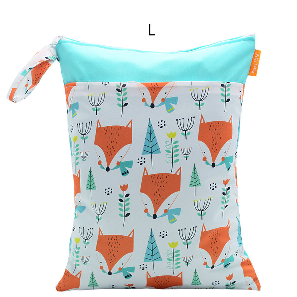 Bright pouch with blue top and handle, featuring an orange fox pattern and colorful trees and flowers on a light background. Labeled as size L with a small orange tag.
