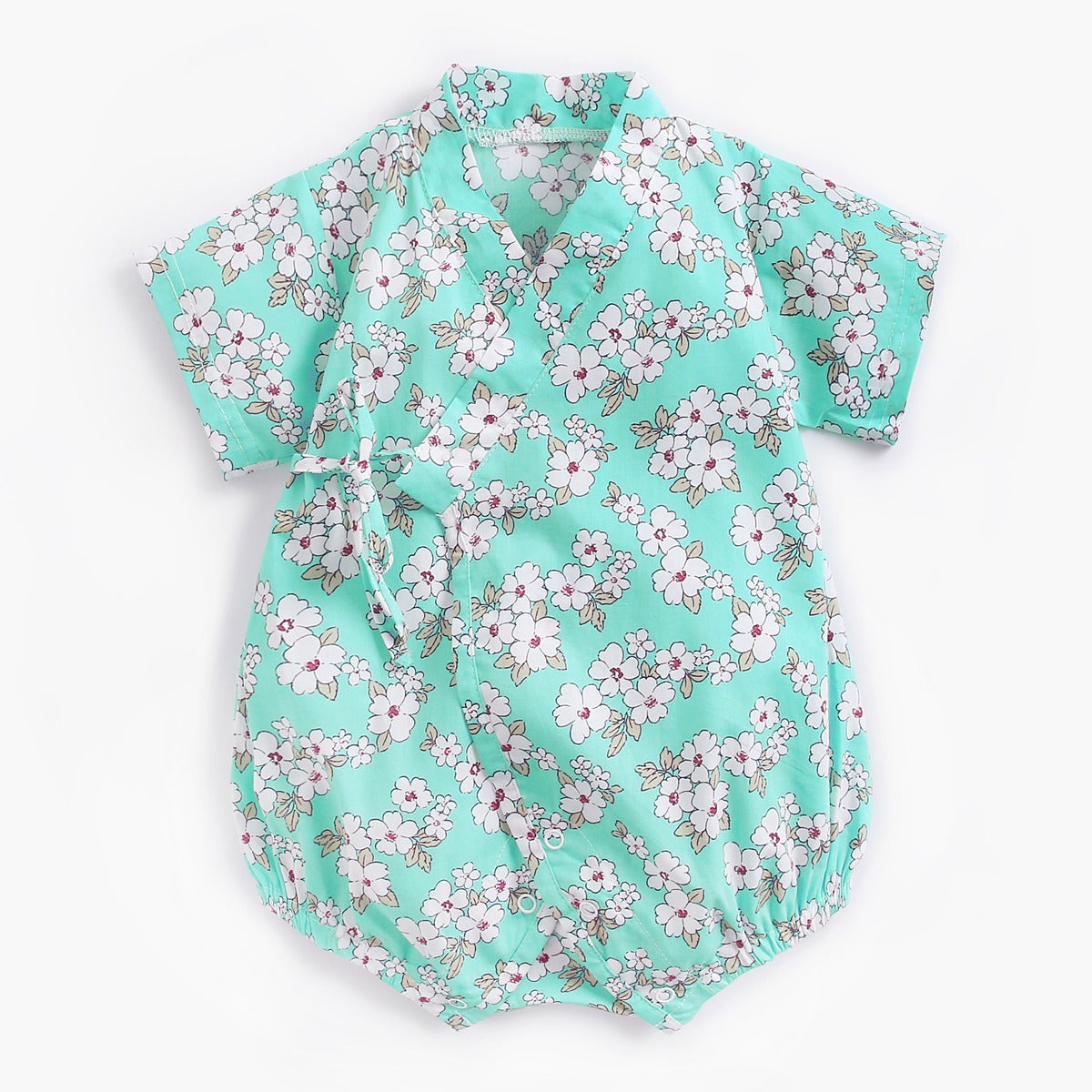 Light blue baby romper with a floral pattern. The short-sleeved garment features white and pink flowers, a wrap-style front, and elastic leg openings.