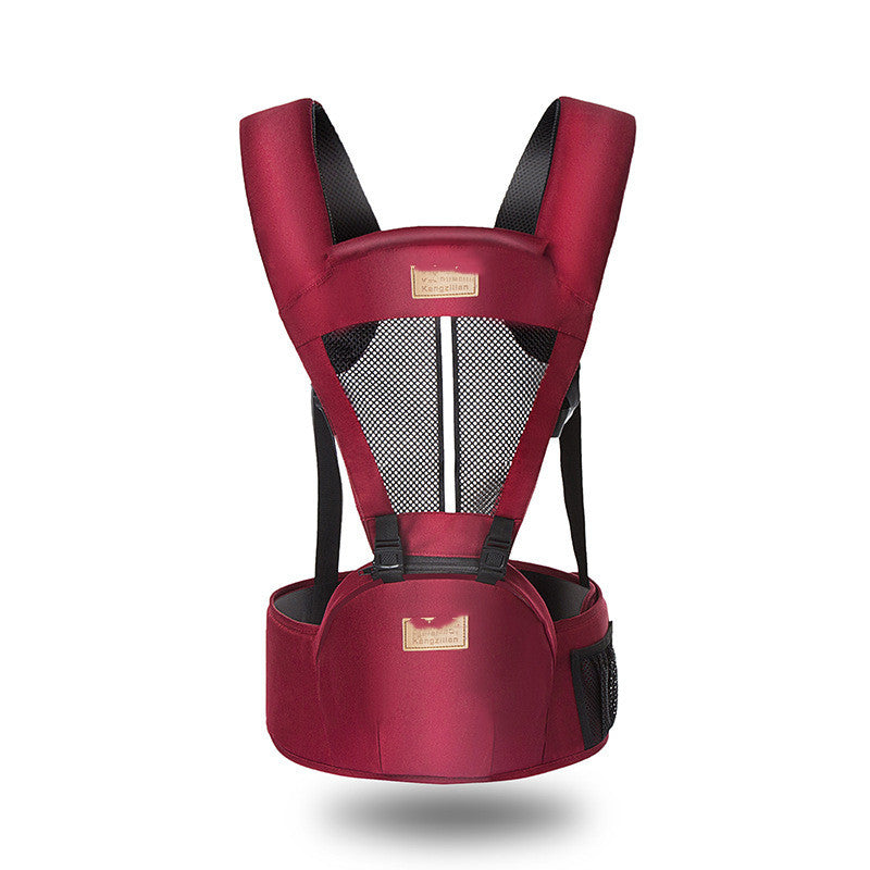 Red baby carrier with padded shoulder straps and a belt for support. Features a mesh back for breathability and a hip seat for comfort.