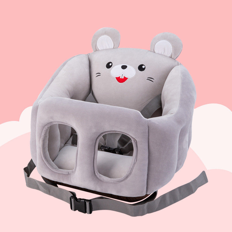 Plush baby seat in mouse shape, with gray fabric, cute face, and ears. Features two leg holes and safety straps. Set against a pink background with white cloud accents.
