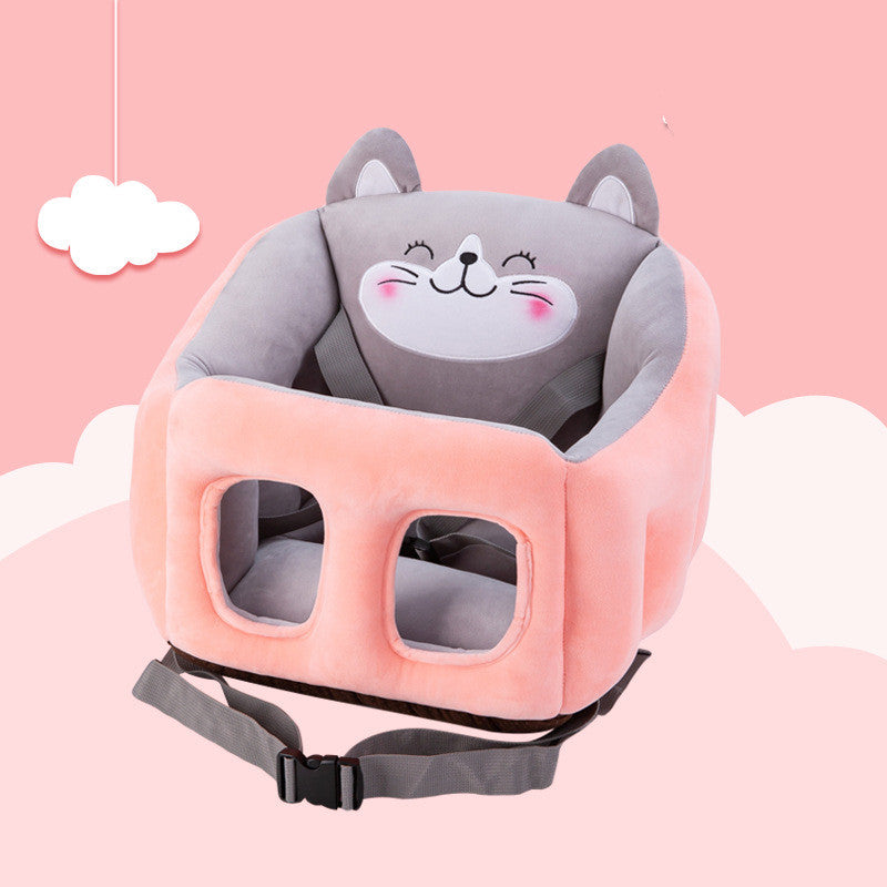 Plush baby seat in pink and gray with a cat face design, featuring ear details and a secure harness. The background is a pastel pink sky with clouds.