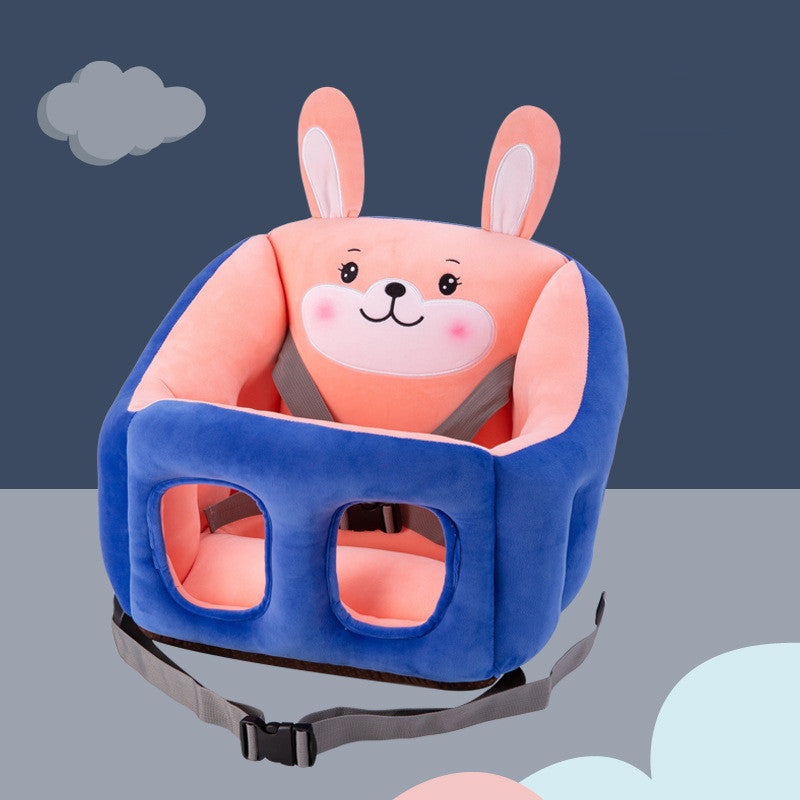 Plush baby chair with a cute pink rabbit design, blue outer lining, and secure straps on a gray background with cloud motifs.