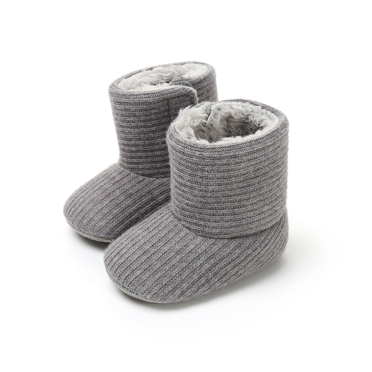 Gray knitted baby boots with soft, plush lining, featuring a ribbed texture. Designed for warmth and comfort, they stand upright on a white surface.