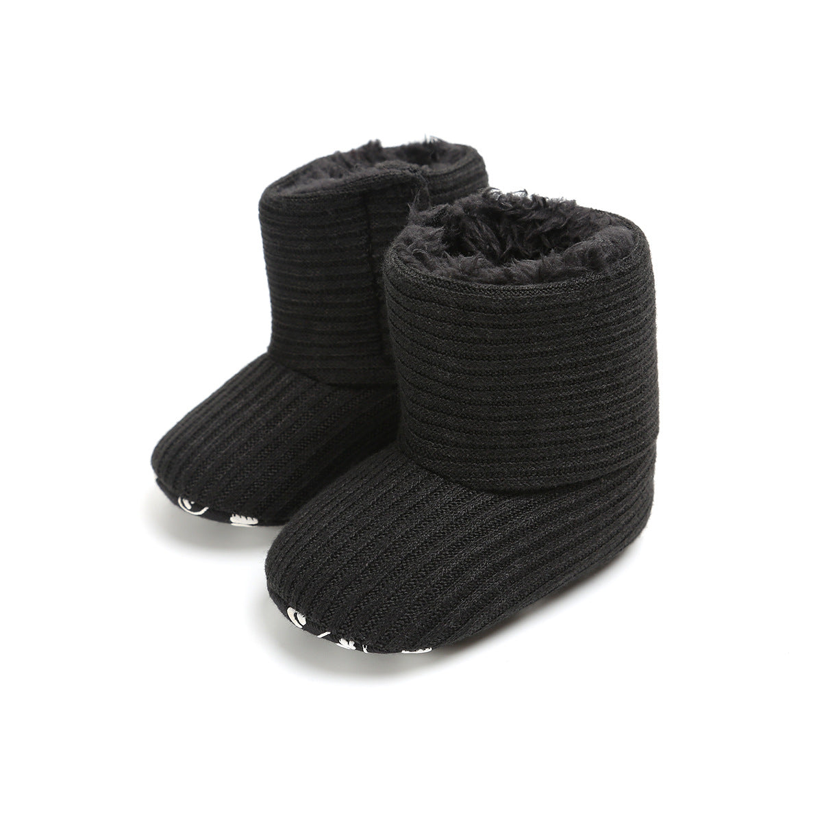Black ribbed baby booties with a soft, fuzzy interior and patterned soles, designed for warmth and comfort.
