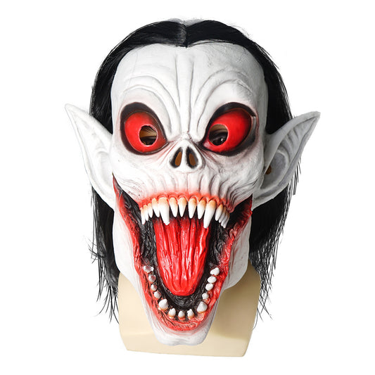 Horror mask with large pointed ears, exaggerated red eyes, sharp teeth, and a wide open mouth. The mask features long black hair and a skeletal nose against a white face.