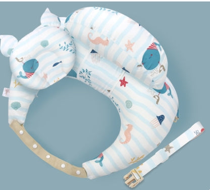 Cute baby neck pillow adorned with marine-themed patterns, including whales and seahorses, on a light blue striped background. Features adjustable strap with beige buckle for securing.
