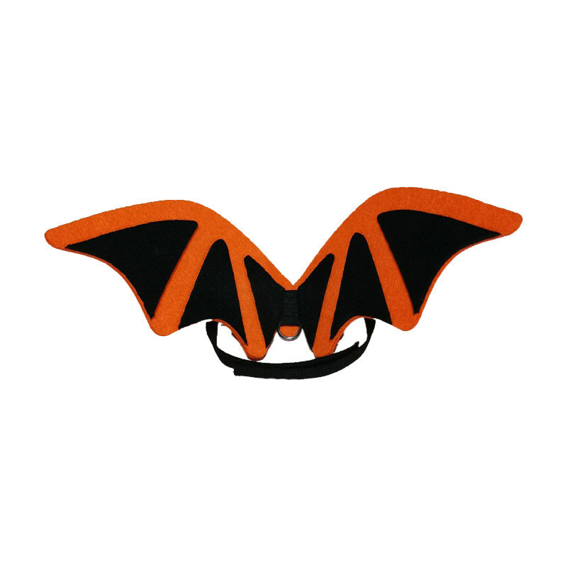 Orange and black bat wings costume accessory with adjustable strap, designed for pets. The wings are symmetrical, with a sleek, minimalist design against a white background.