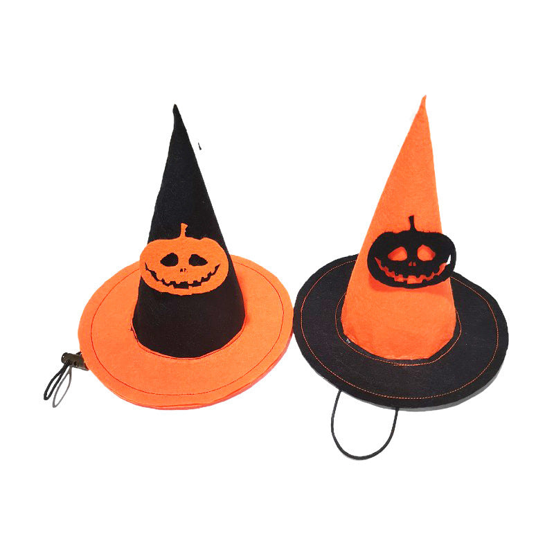Two Halloween witch hats with jack-o'-lantern designs. One hat is orange with a black band, the other is black with an orange band. Both have elastic straps.