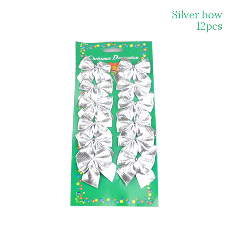 A set of 12 silver decorative bows on a green package labeled "Christmas Decoration." The bows are arranged in two vertical rows of six.