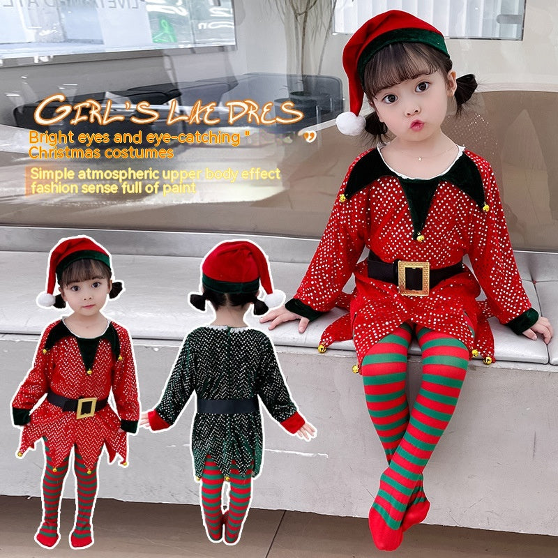 A young child in a festive red elf costume with green stripes and a Santa hat sits and poses playfully. Two additional views show the front and back of the outfit.