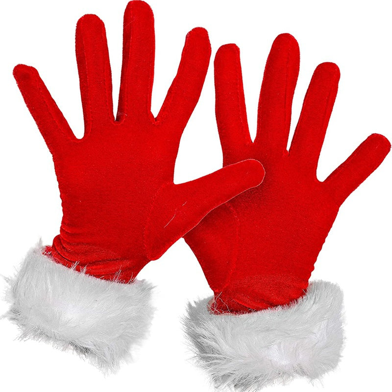 Red festive gloves with white faux fur cuffs, spread open against a plain background. The gloves have a soft texture and vibrant color, evoking a holiday theme.
