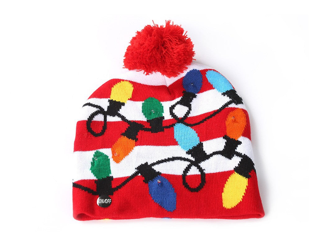 Red and white striped beanie with colorful Christmas lights design and a red pom-pom on top. An "ON/OFF" button is visible near the bottom.