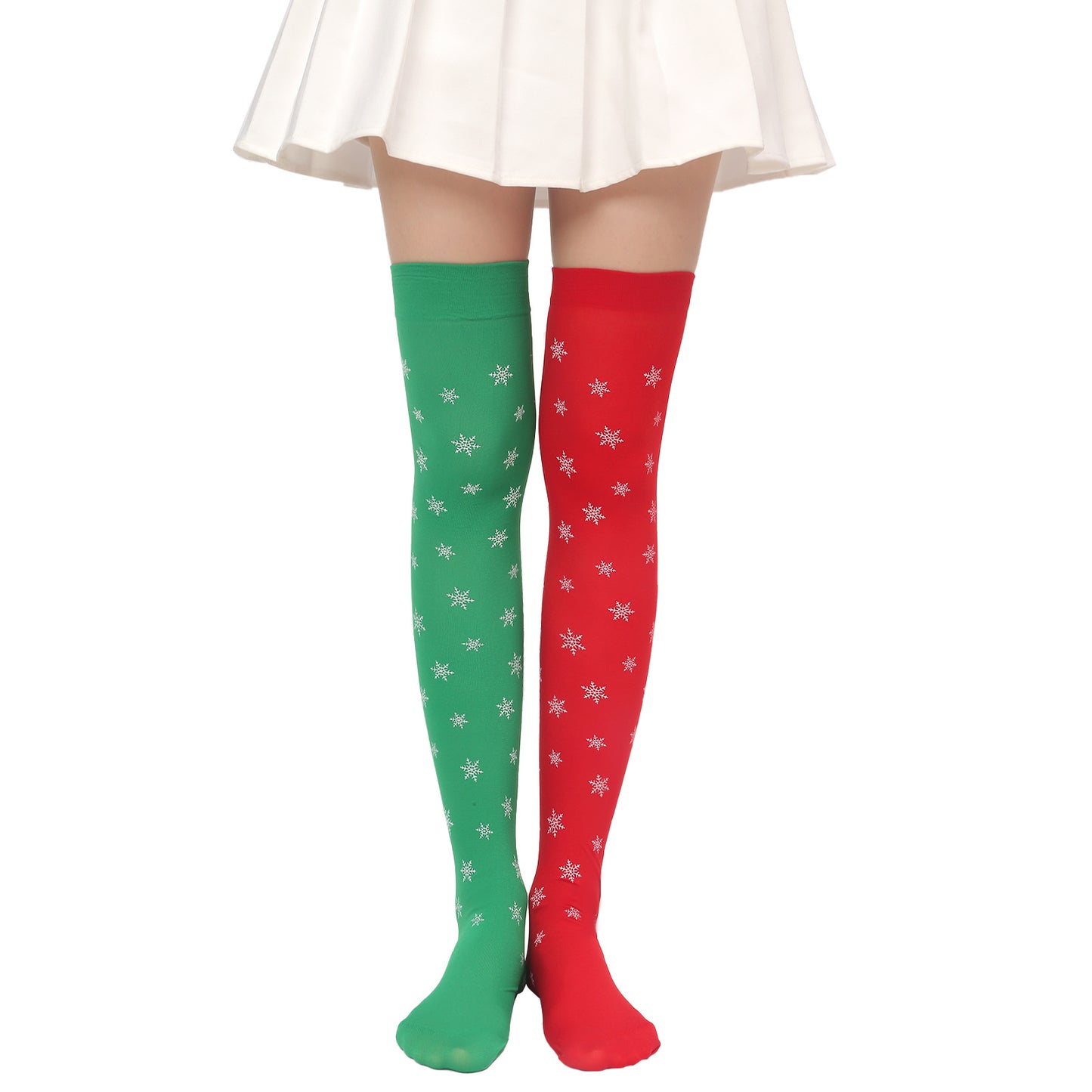 Woman wearing knee-high socks; one green with snowflakes, the other red with snowflakes, under a white skirt.