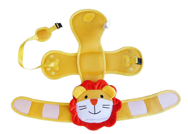 Yellow and red lion-themed kids' safety harness with adjustable straps and buckle. Lion face at the center with mesh padding, extended wings, and paw prints on straps.