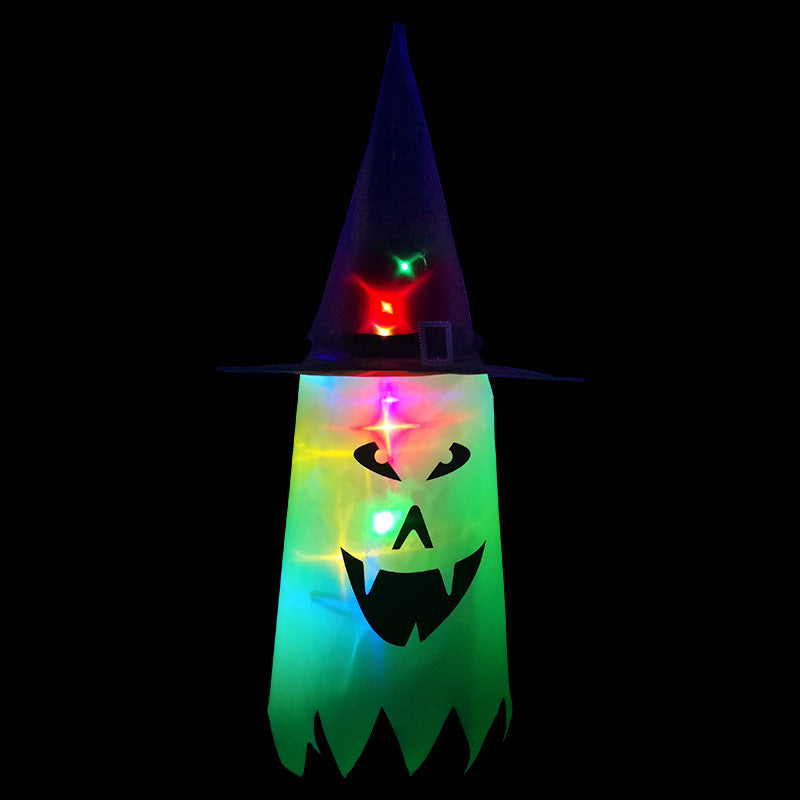 Colorful glowing ghost with a witch hat, featuring a spooky face and vibrant lights, against a black background. Perfect Halloween decoration emitting a festive, eerie glow.