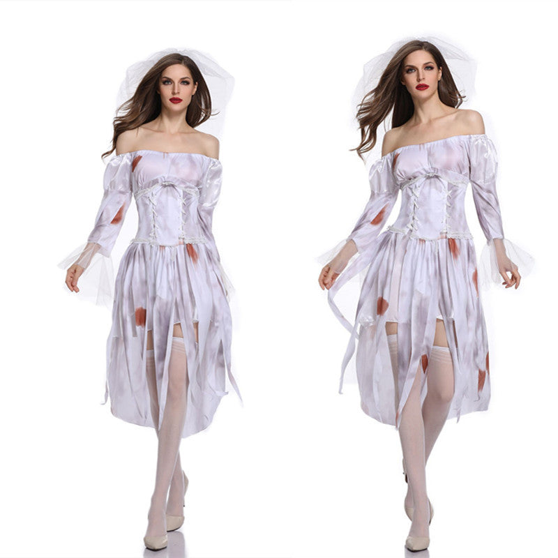 Two women in torn, white off-shoulder bridal costumes with bloodstains, wearing white stockings and heels, pose on a white background.