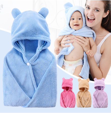 Baby in a blue hooded fleece towel with bear ears, held by a smiling woman. Three additional hooded towels in pink, beige, and lavender are shown below.