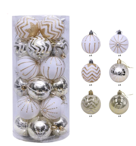 A set of 24 Christmas tree ornaments in gold, white, and silver with patterns including chevrons, stripes, and dots, displayed in a clear cylindrical container.