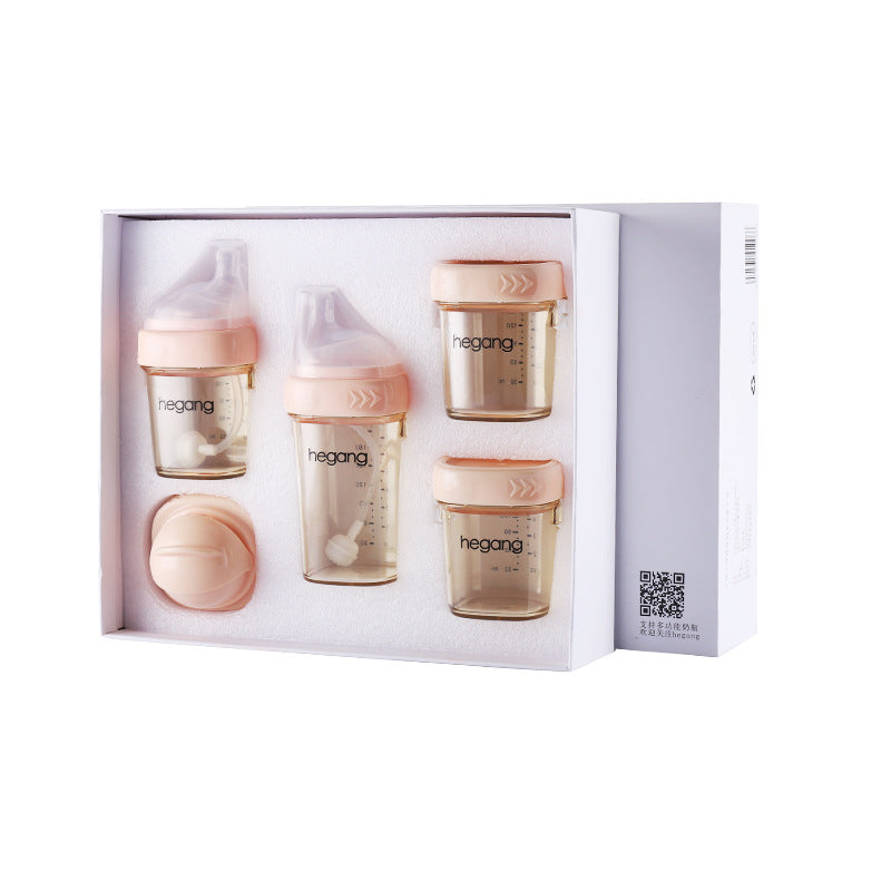 Box set of baby feeding bottles and containers with pink lids, marked with measurements. Includes two bottles with soft tops, two sealed containers, and a pink accessory part.