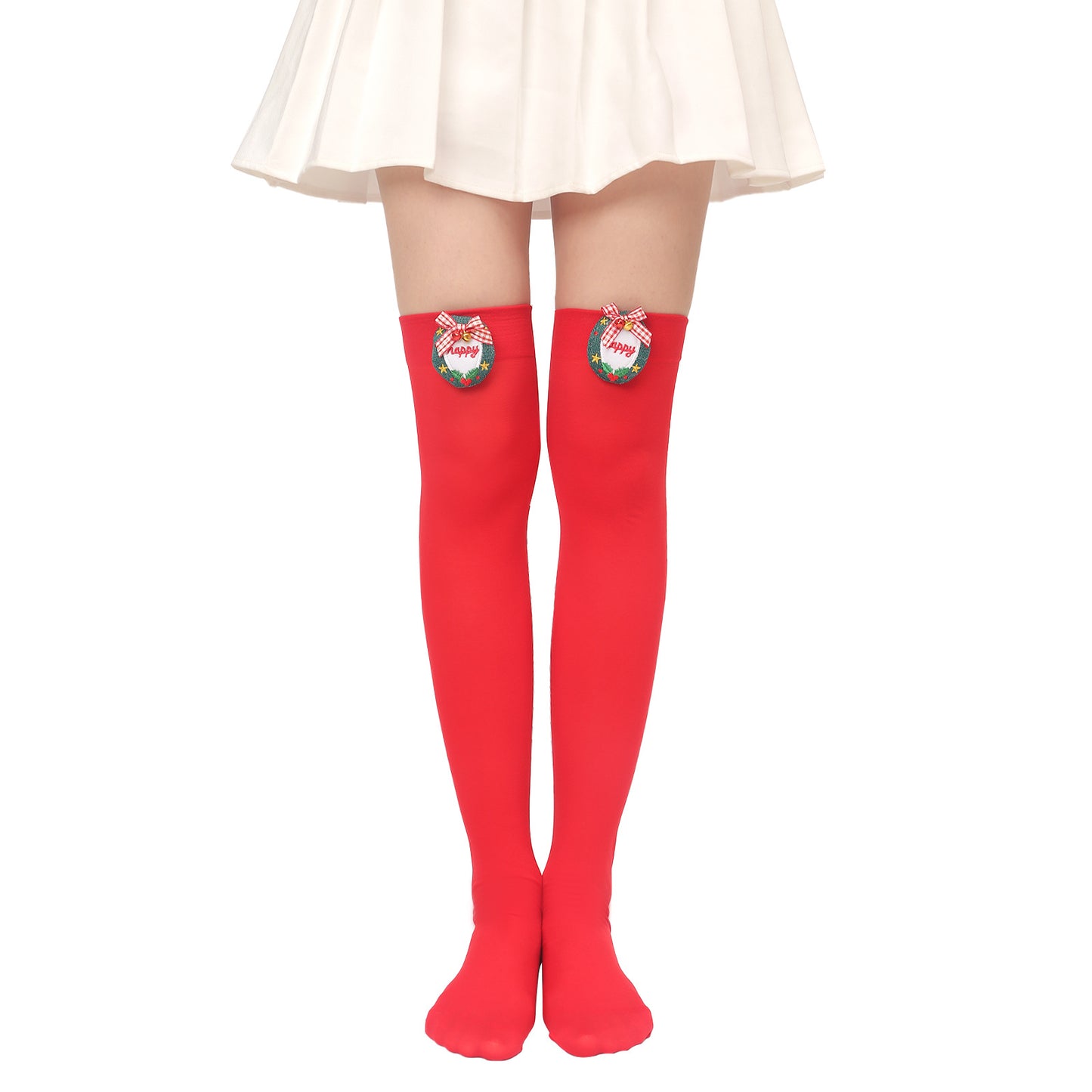 Person wearing red thigh-high stockings with festive decorations, featuring bows and wreaths, paired with a white pleated skirt.