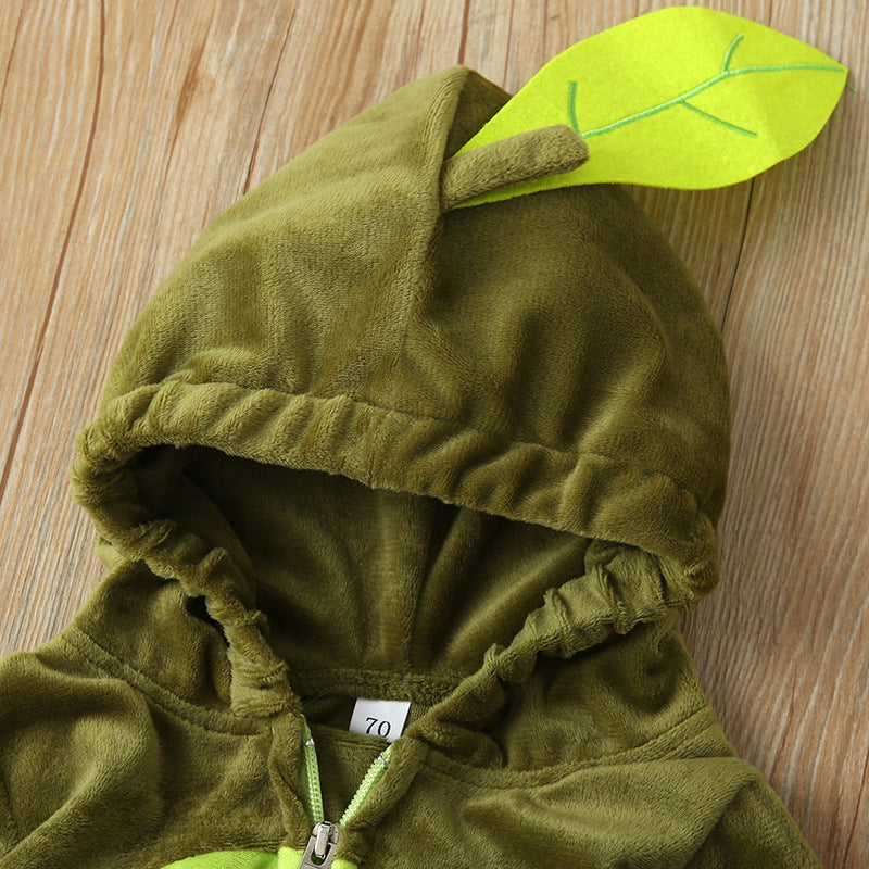 Green plush hoodie with a zip closure, featuring a cute leaf design on the hood. Size tag indicates "70". The fabric appears soft and comfortable, resting on a wooden surface.
