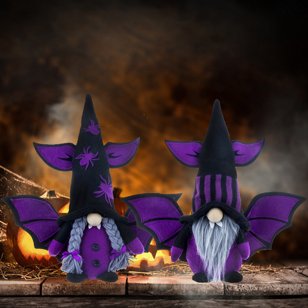 Two Halloween gnomes stand in front of a glowing backdrop. The left gnome has a purple outfit with braided hair, a tall hat with spider designs, and bat wings. The right gnome has a striped hat, bat wings, and a long gray beard. Both hats are pointed, creating a whimsical look.