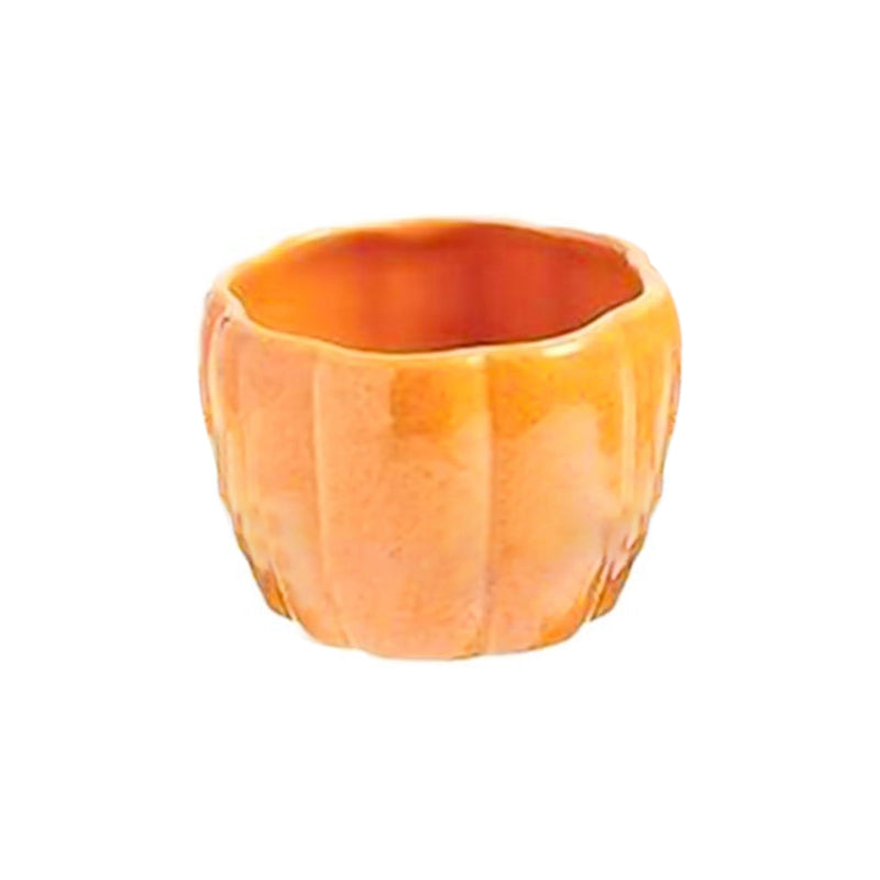 Orange pumpkin-shaped ceramic bowl with a smooth, glossy finish and ribbed texture, empty and isolated on a white background.