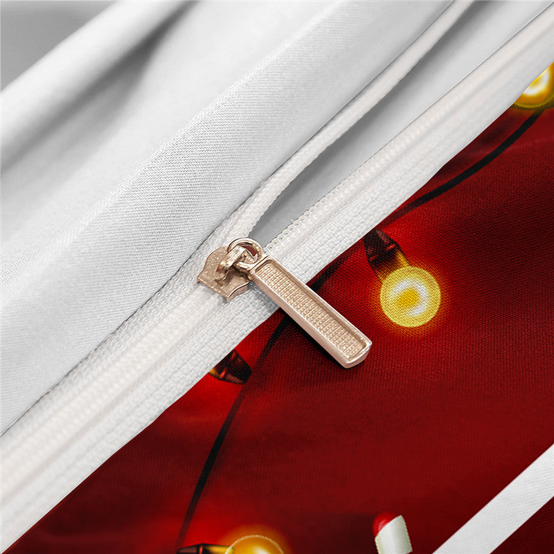 Close-up of a white zipper on a fabric with a festive red and yellow light pattern. The zipper handle is metallic, and the colors are vibrant and cheerful.