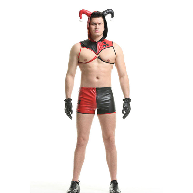A man in a jester-inspired costume with a red and black theme, featuring a hood with horns, matching shorts, and black gloves, stands against a white background.