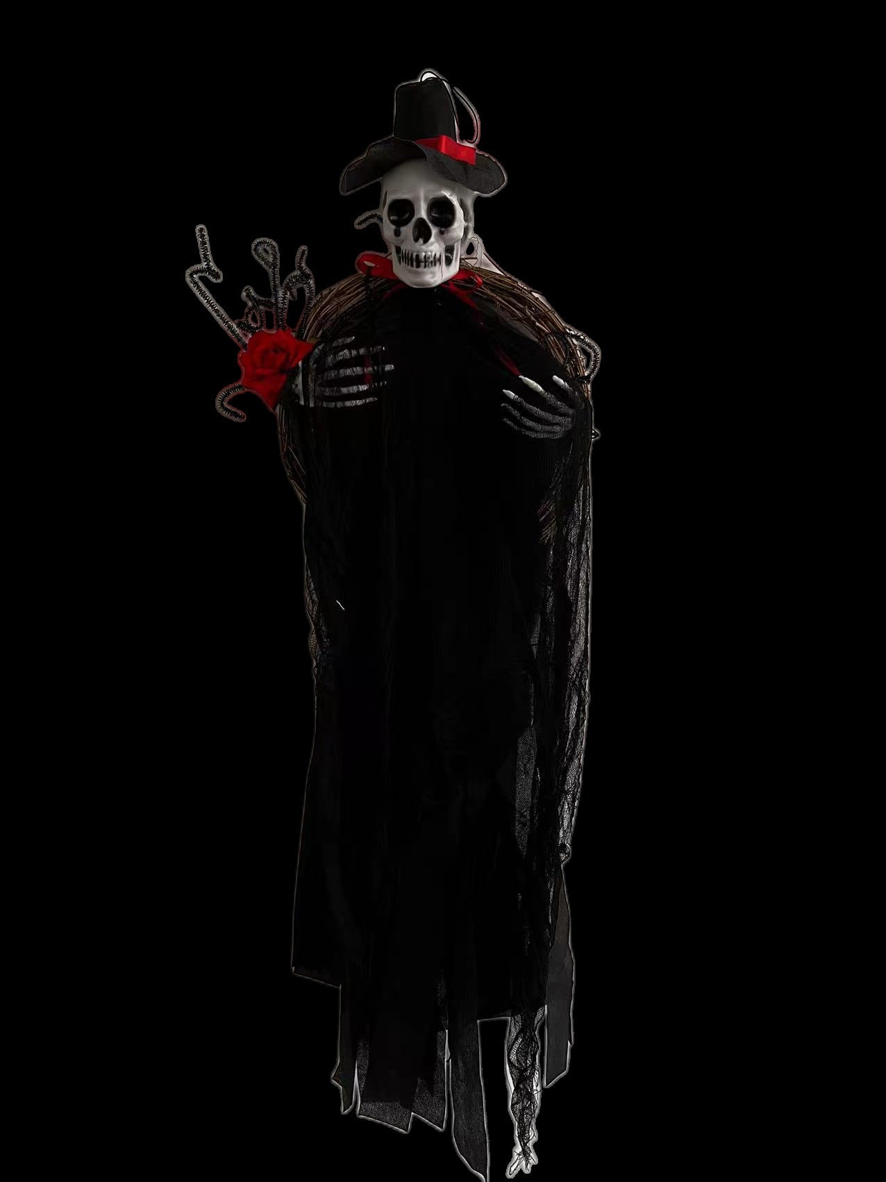 A spooky skeleton figure dressed in a black cloak with a hat adorned with red accents. The figure holds a branch and red rose on one side, set against a dark background, creating a mysterious and eerie atmosphere.
