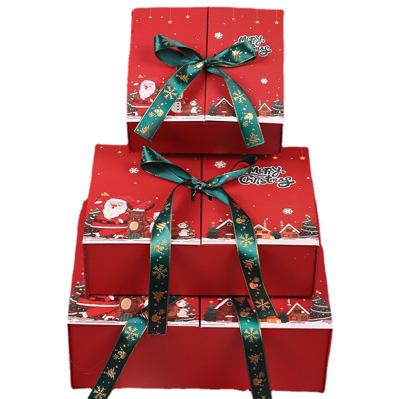 Three stacked red gift boxes with green and gold snowflake ribbons. Each box depicts Santa, a snowman, and snowy houses, with "Merry Christmas" text on top.