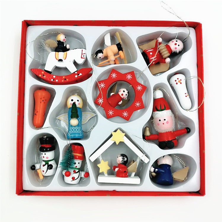 Box of assorted Christmas ornaments, including a snowman, Santa, angels, and various festive figures, arranged in a red-edged tray with a clear lid.